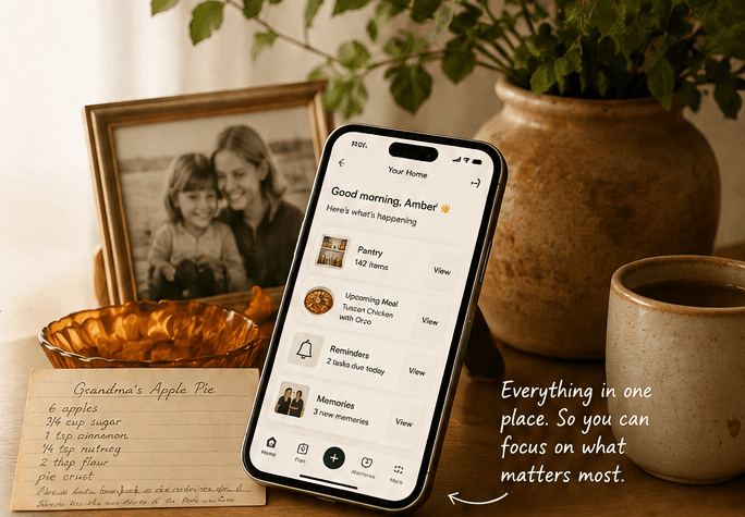 A family photo, a handwritten recipe card and HearthIQ open on a phone, on a kitchen counter